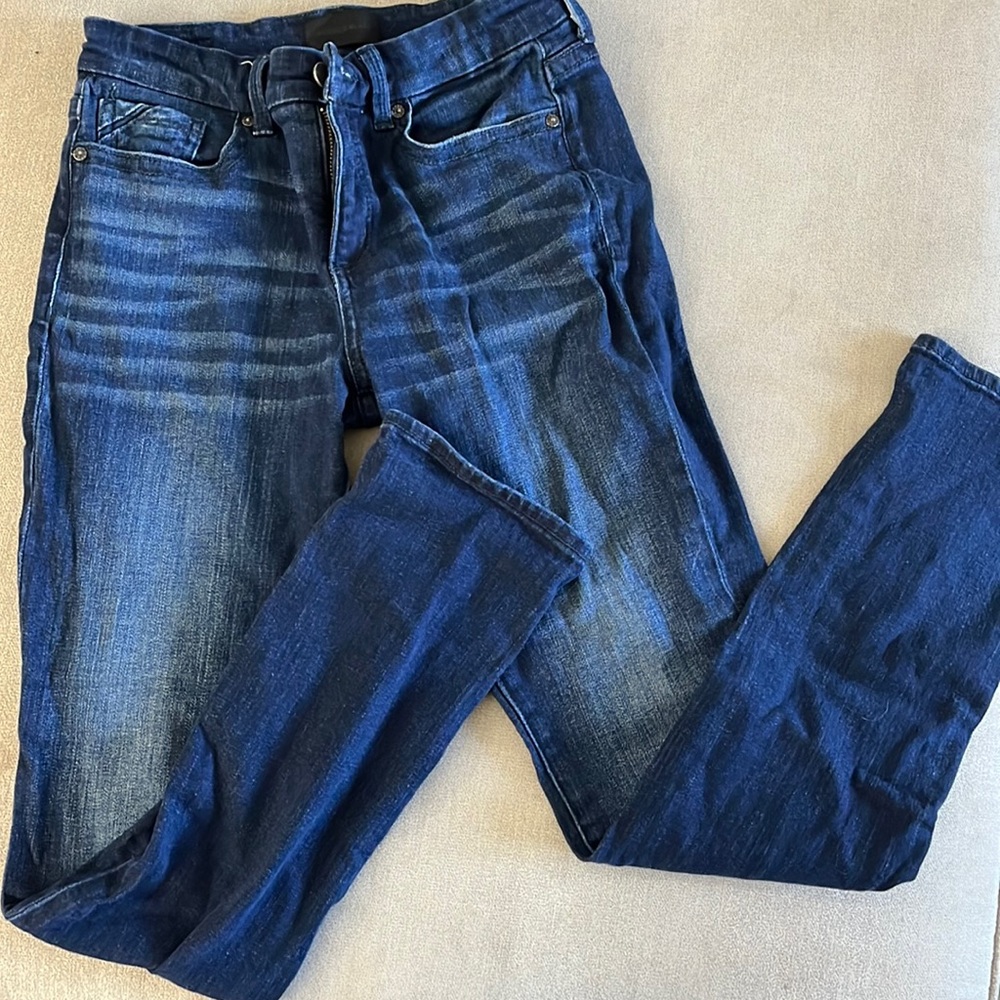 Buckle black skinny jeans